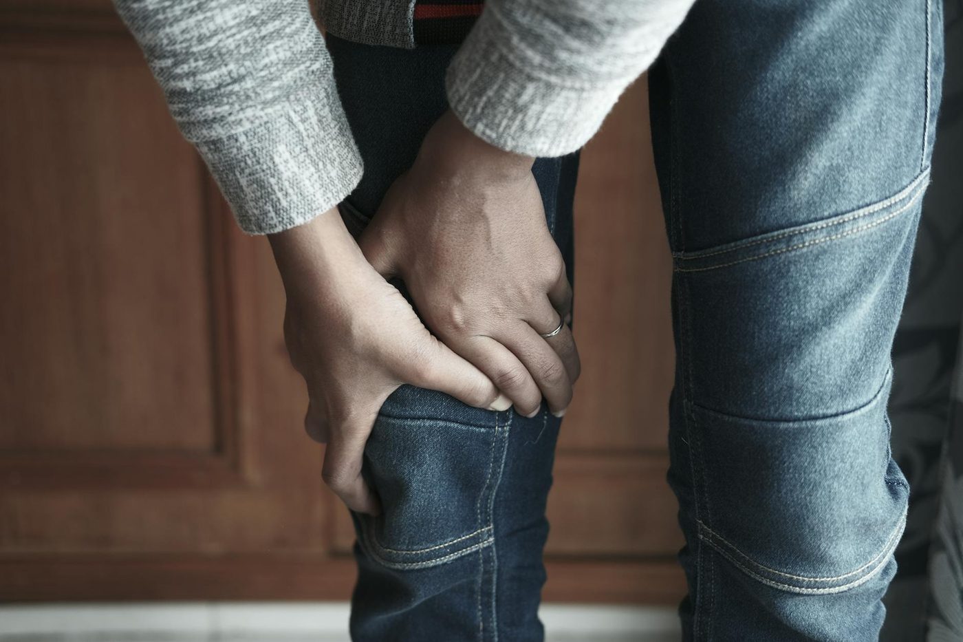 Close-up of a person holding the knee